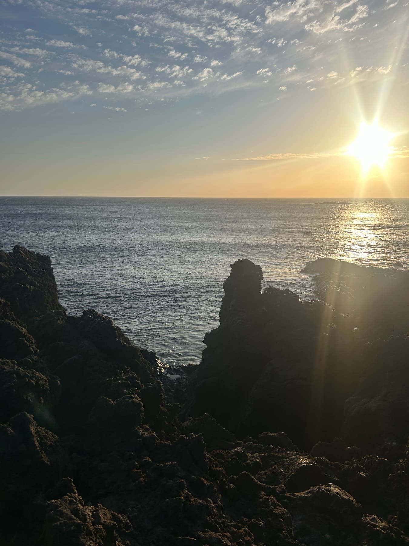Sunset over a sea stack and the ocean