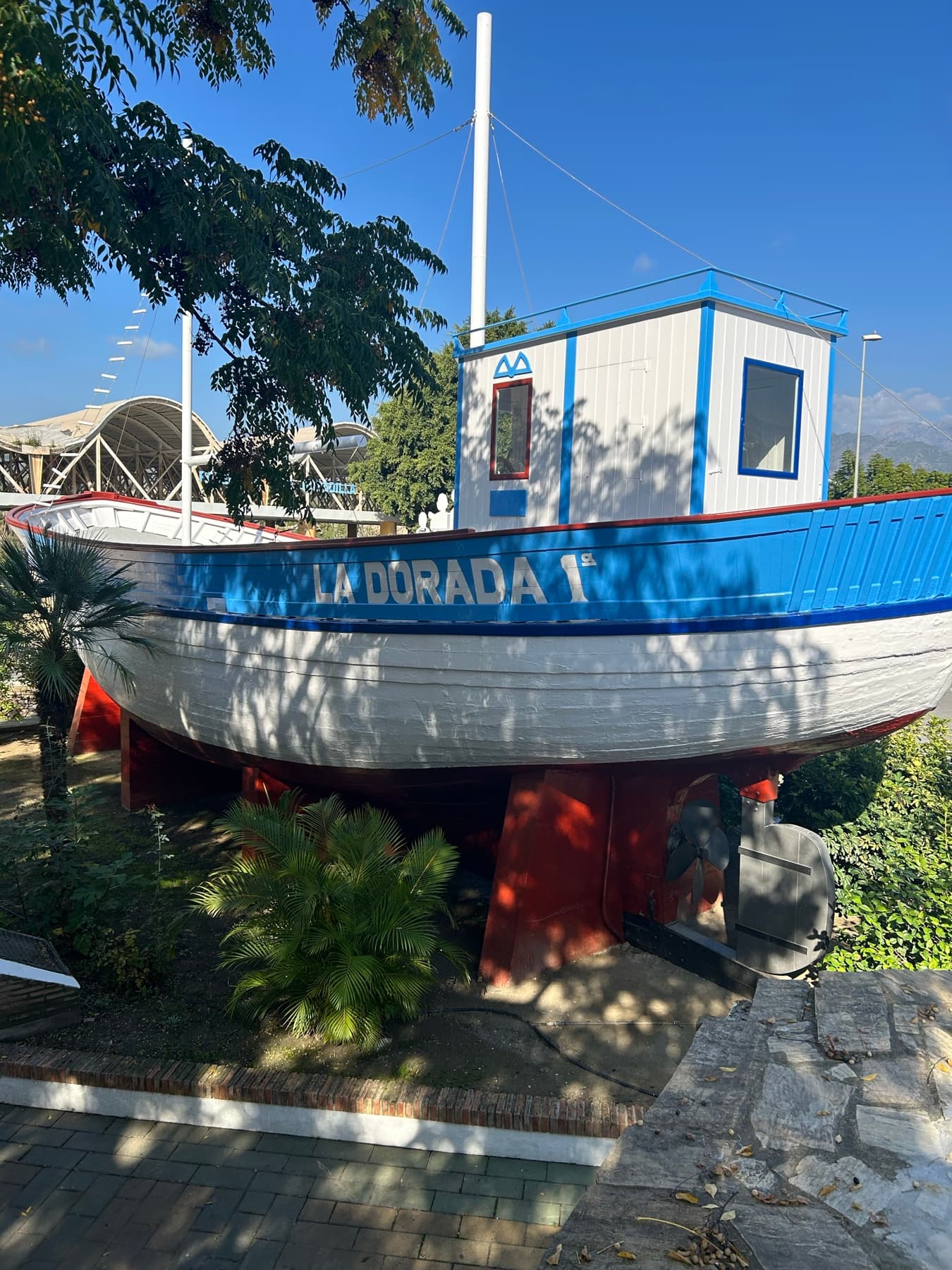 Blue La Dorada boat placed on land