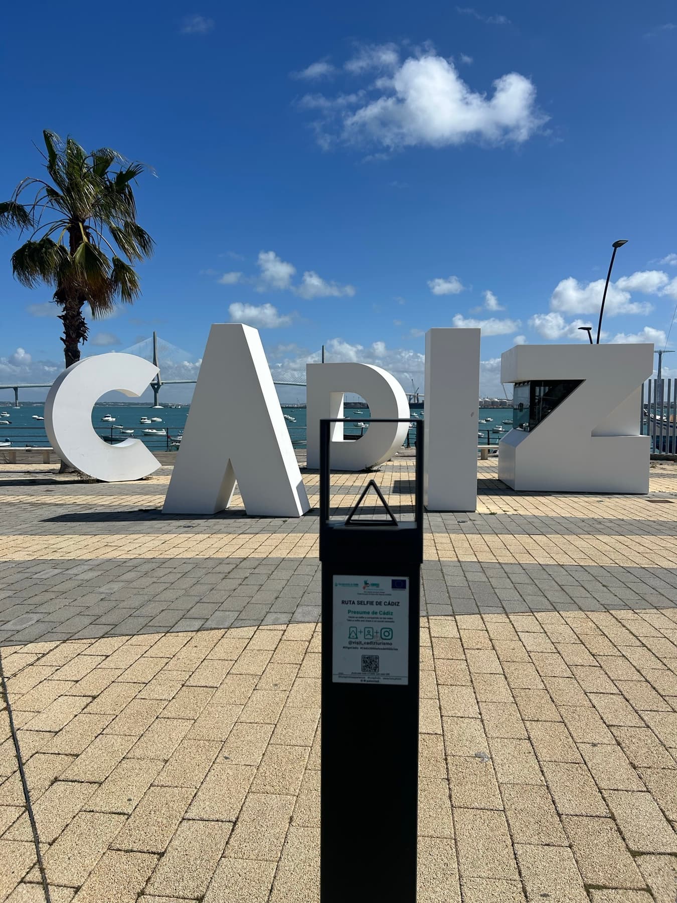 Bicycle beside the Cadiz letters