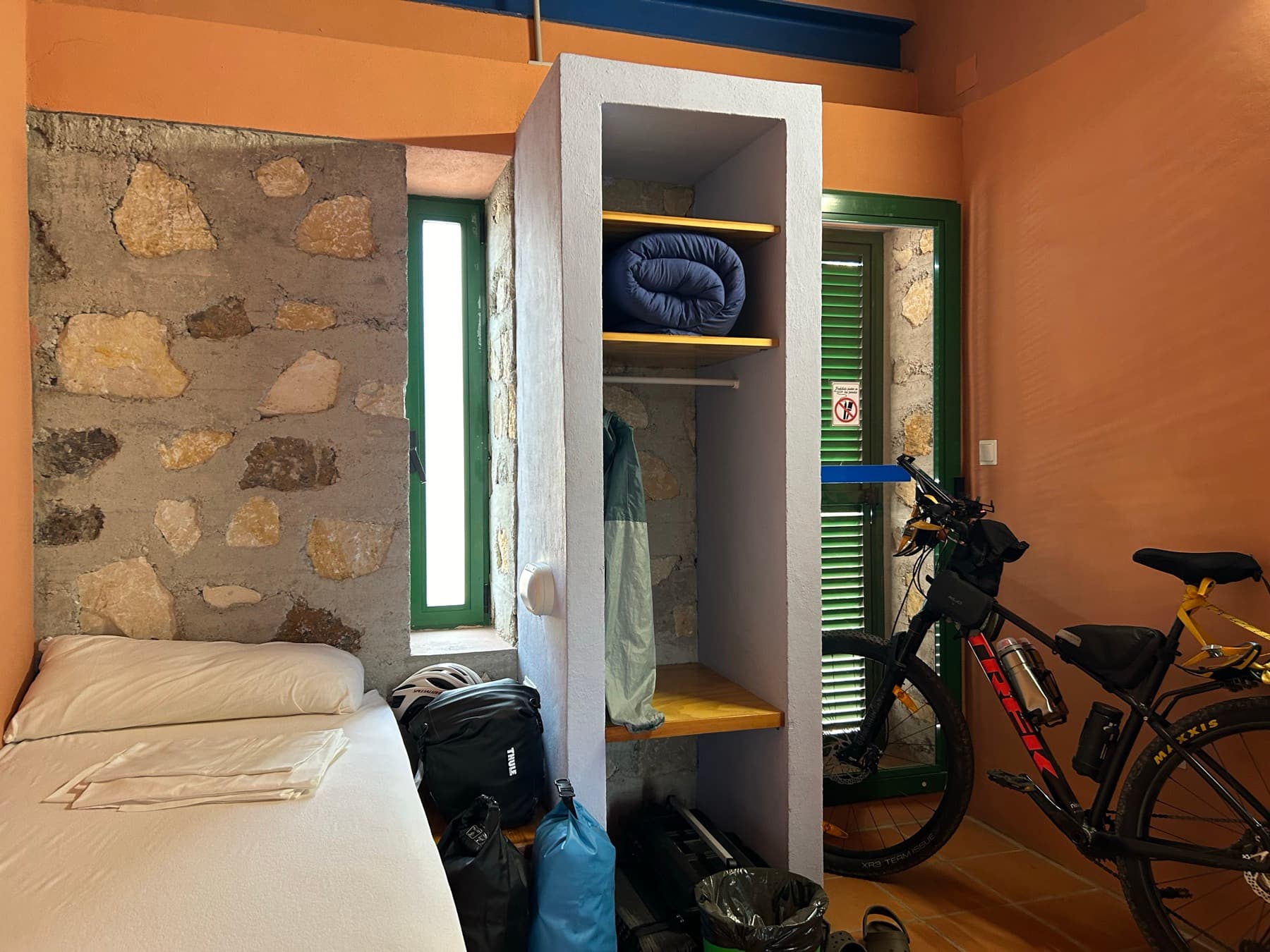 Room with the bicycle inside and luggage ready