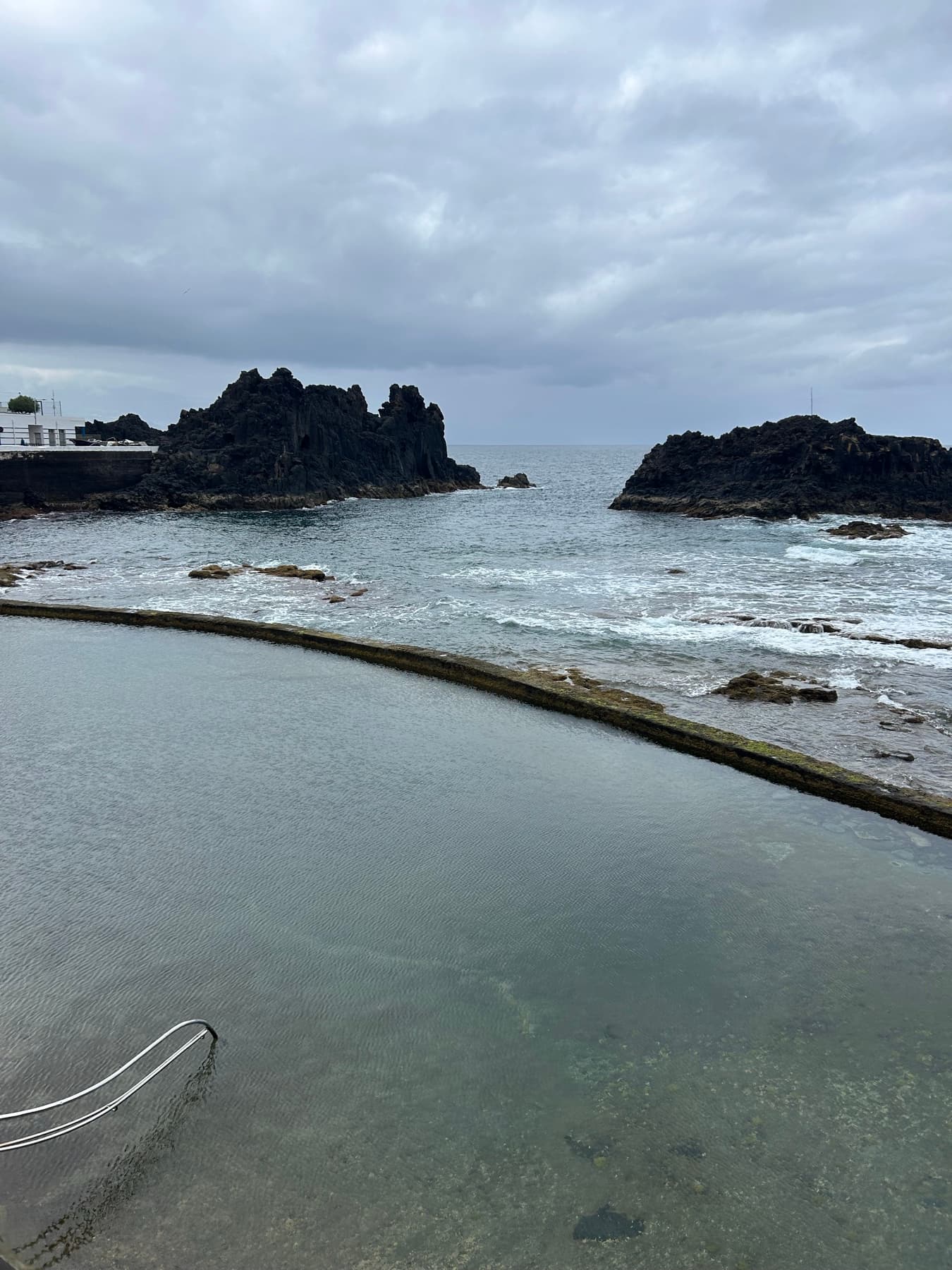 Natural pool among black rocks