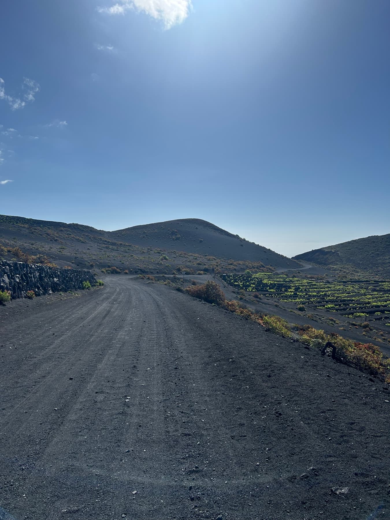 Black track crossing a volcanic landscape