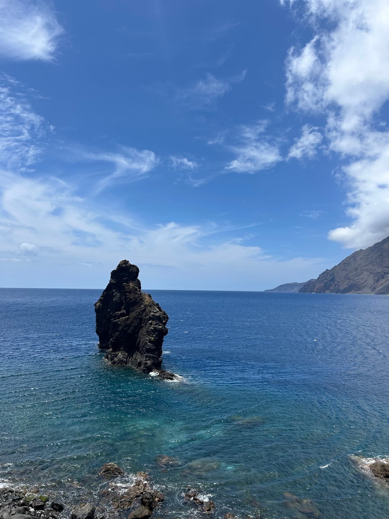 Sea stack under a blue sky